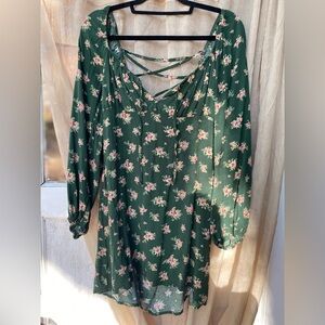 Cute green floral dress with flowy sleeves and lace up back